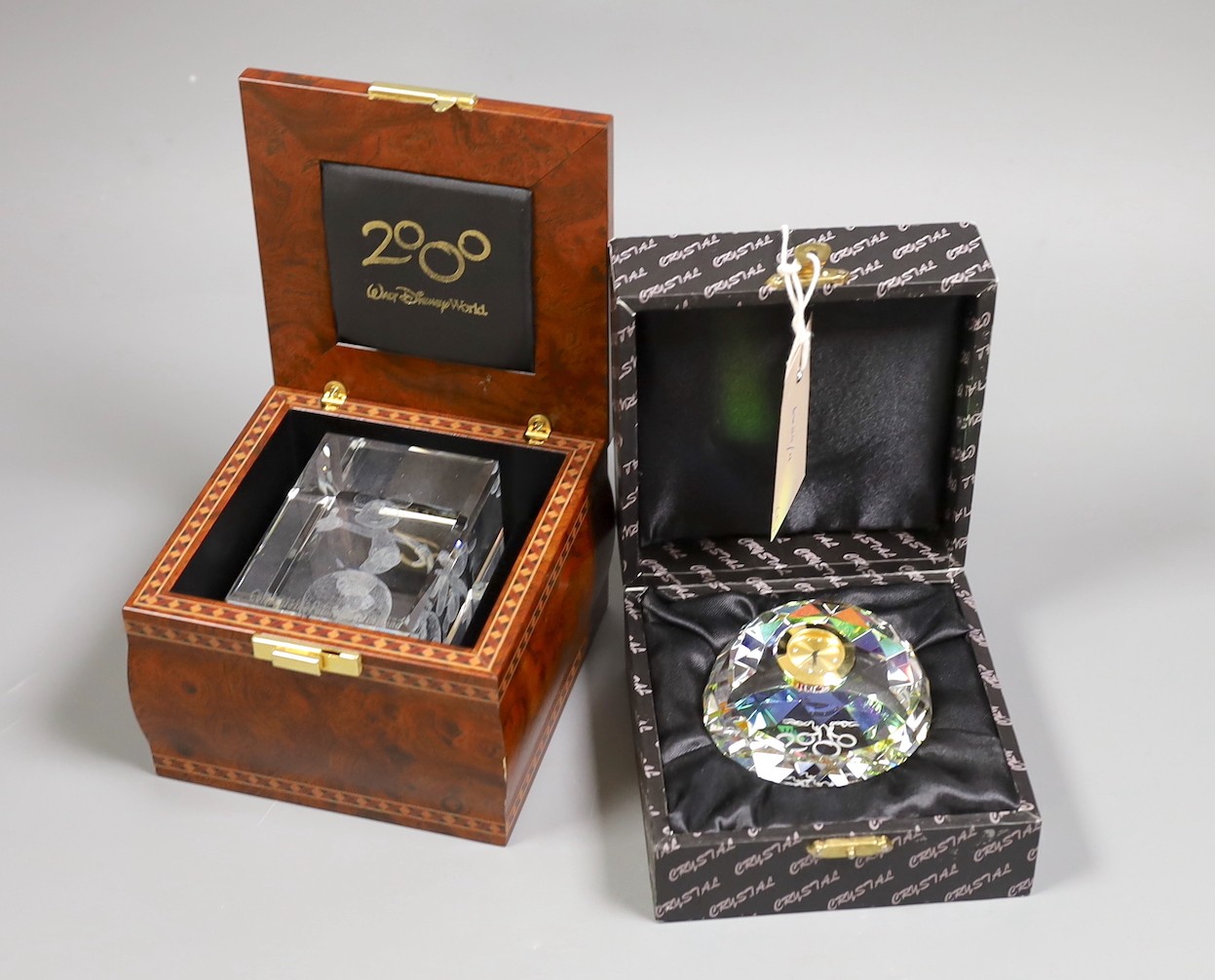 Walt Disney World limited edition crystal cube, 2000 and a Disney 2000 crystal timepiece, both boxed